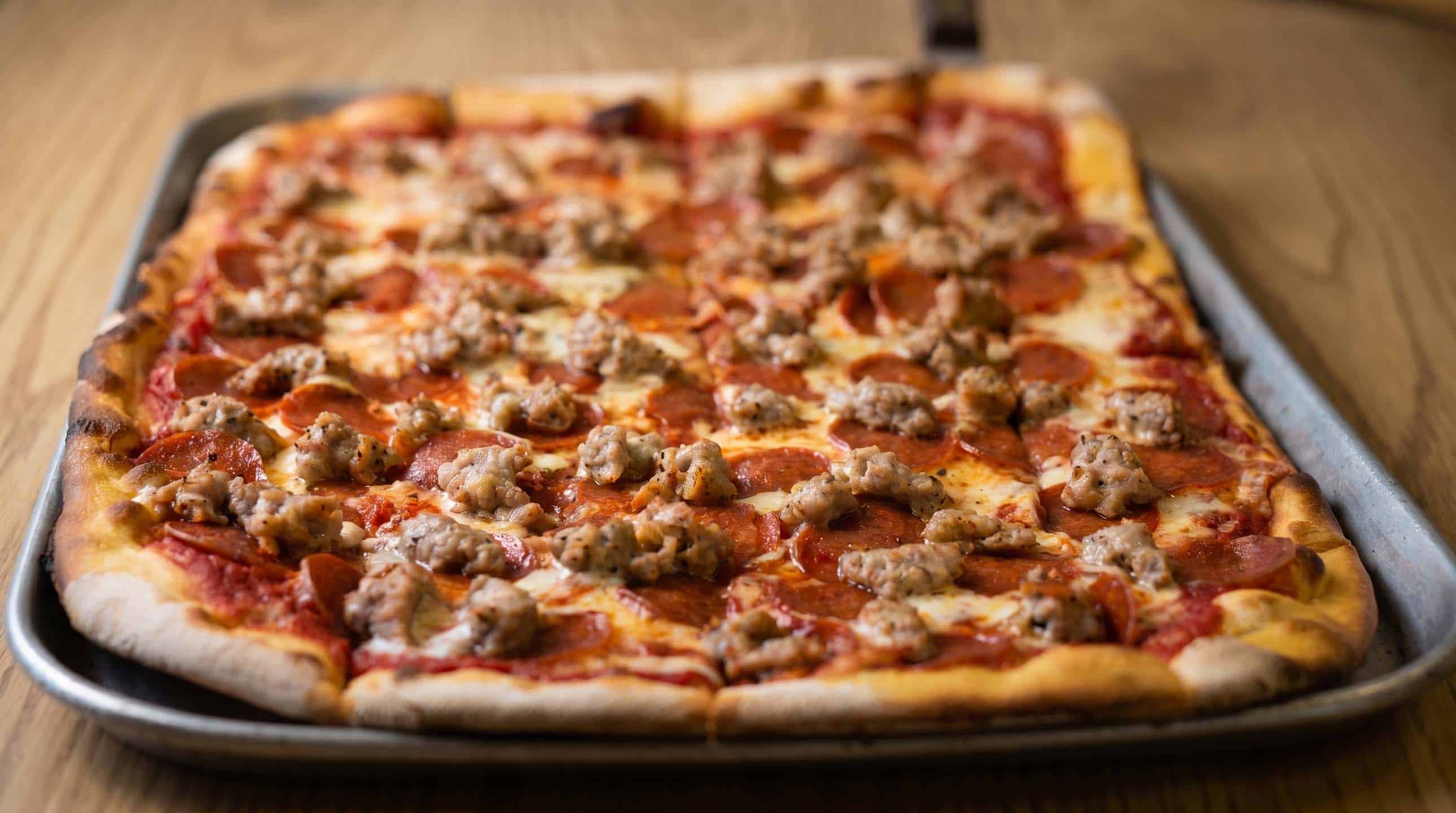 Specialty pie with pepperoni and sausage delivered to Cliffwood, NJ